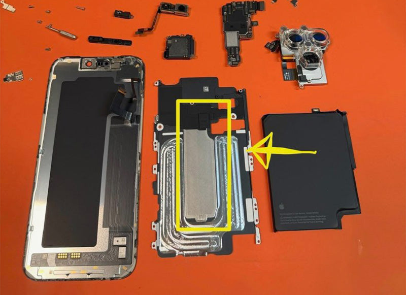 Disassembled smartphone components on an orange background