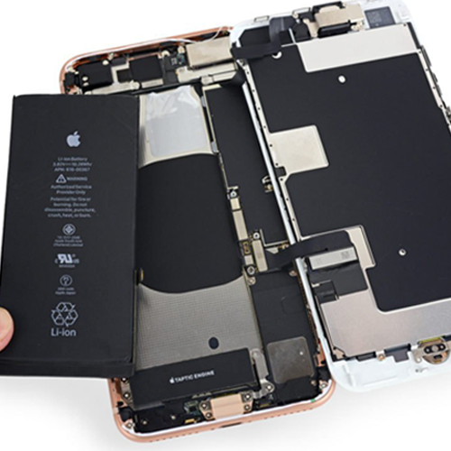 Disassembled smartphone with internal components on a white background